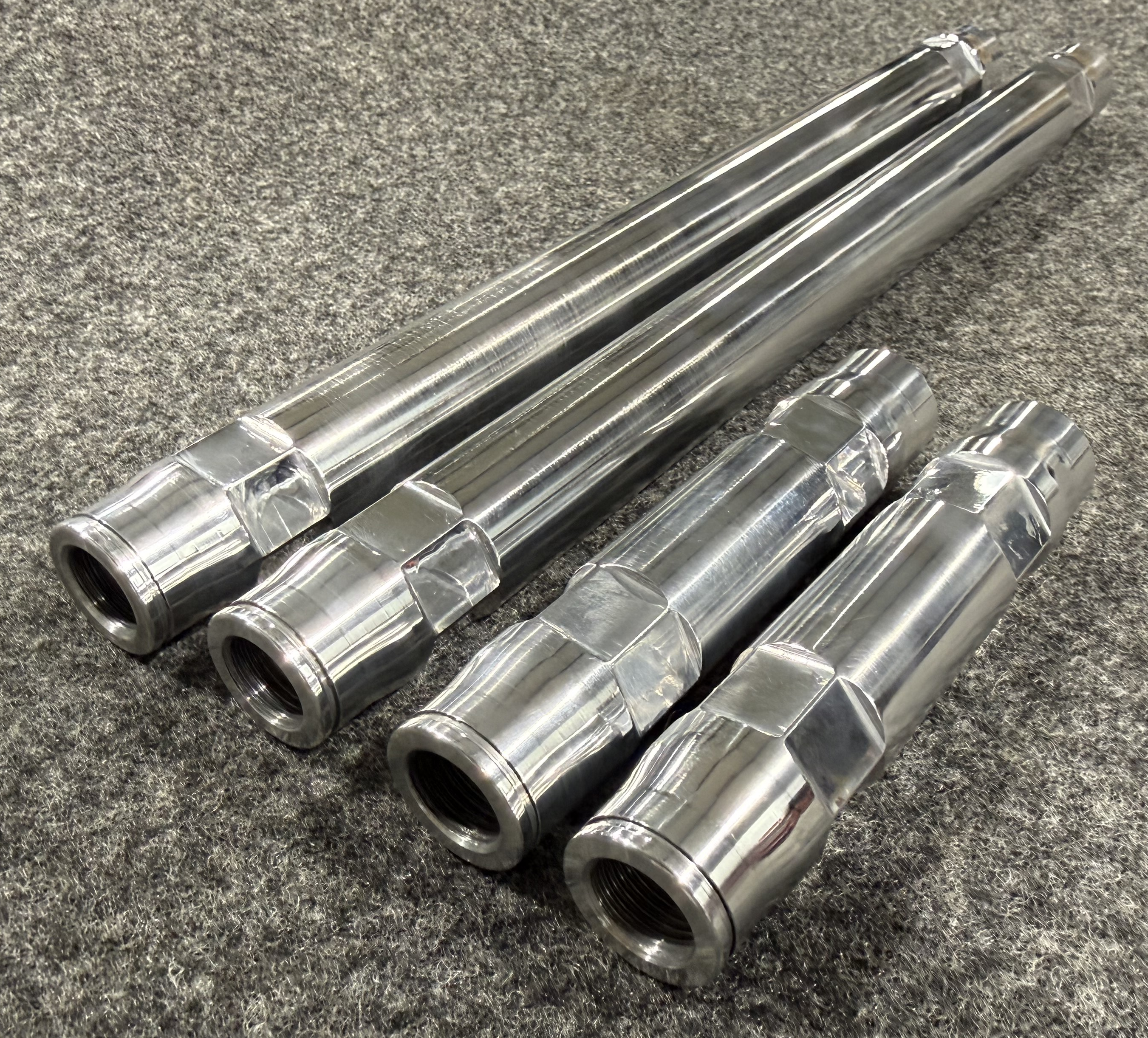 Machined 7075 aluminium sway bar linkage components for race car suspension